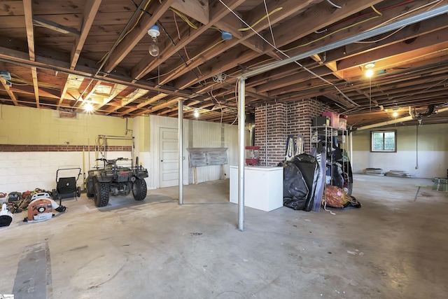 basement featuring concrete block wall