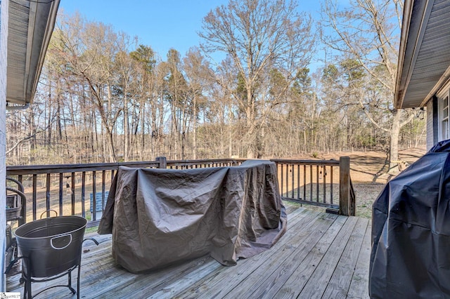 wooden terrace with area for grilling