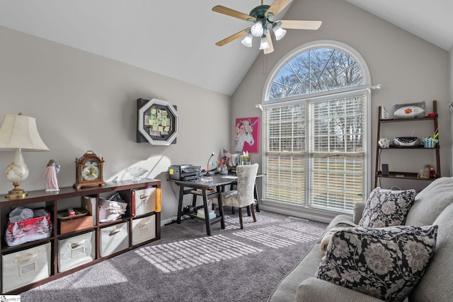 carpeted home office with a ceiling fan, a wealth of natural light, and high vaulted ceiling