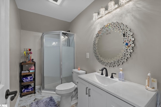 full bath featuring a stall shower, marble finish floor, vanity, and toilet