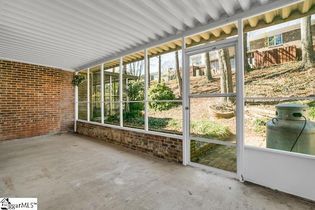 unfurnished sunroom with plenty of natural light