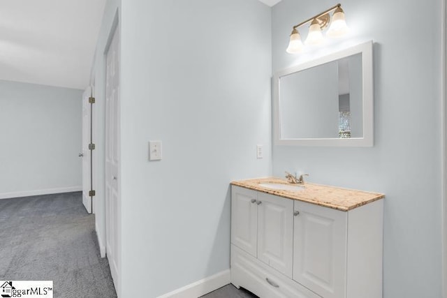 bathroom with baseboards and vanity