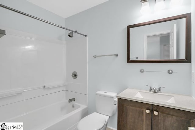 bathroom with toilet, tub / shower combination, and vanity