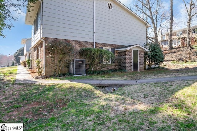 view of home's exterior with brick siding