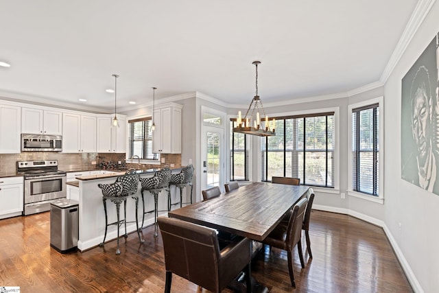 dining room with recessed lighting, crown molding, baseboards, dark wood finished floors, and an inviting chandelier