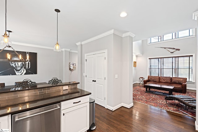 kitchen featuring dark wood-style floors, open floor plan, ornamental molding, dishwasher, and dark countertops