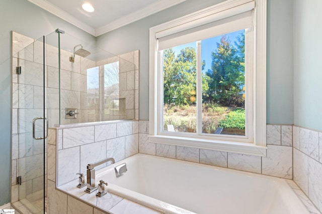 bathroom featuring ornamental molding, a stall shower, a garden tub, and a wealth of natural light