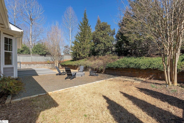 view of yard featuring a patio area and fence