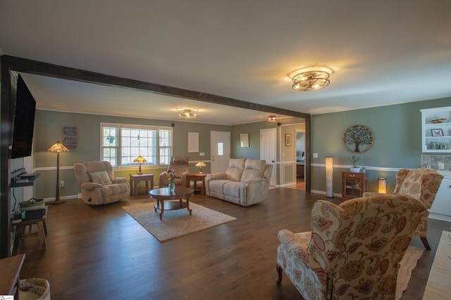 living room featuring baseboards and wood finished floors