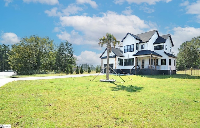 modern farmhouse with board and batten siding and a front yard