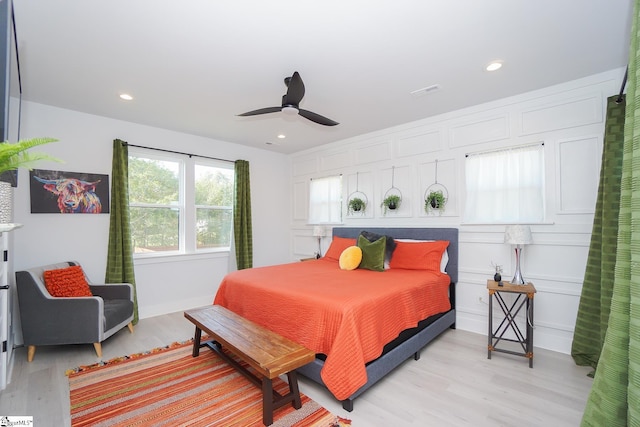 bedroom with light wood-style floors, recessed lighting, and visible vents