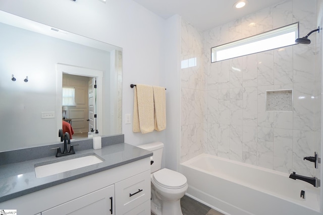 bathroom featuring shower / tub combination, toilet, recessed lighting, vanity, and ensuite bath