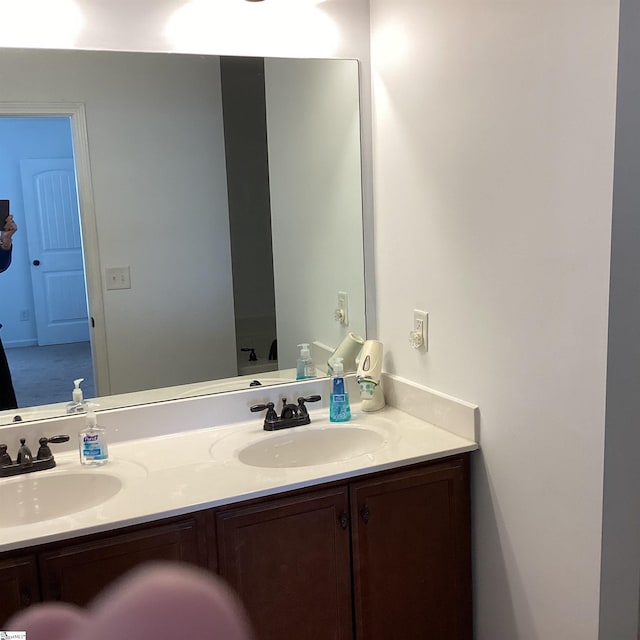 bathroom featuring double vanity and a sink