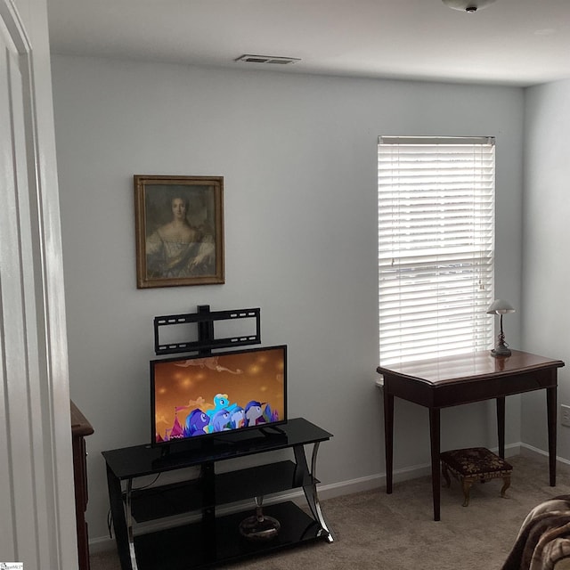 office area with carpet floors, visible vents, and baseboards