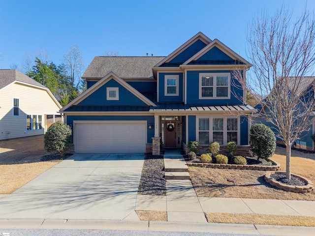 craftsman-style home featuring metal roof, concrete driveway, a standing seam roof, and an attached garage