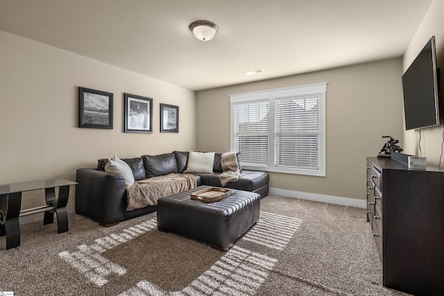 living area featuring carpet flooring, visible vents, and baseboards