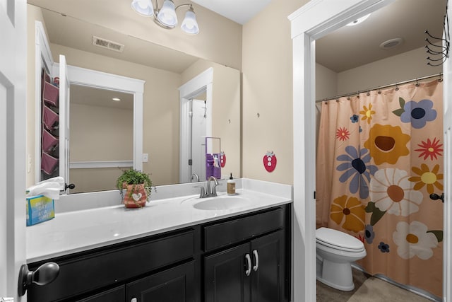 full bath with toilet, vanity, and visible vents