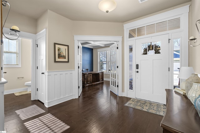 foyer entrance with dark wood-type flooring