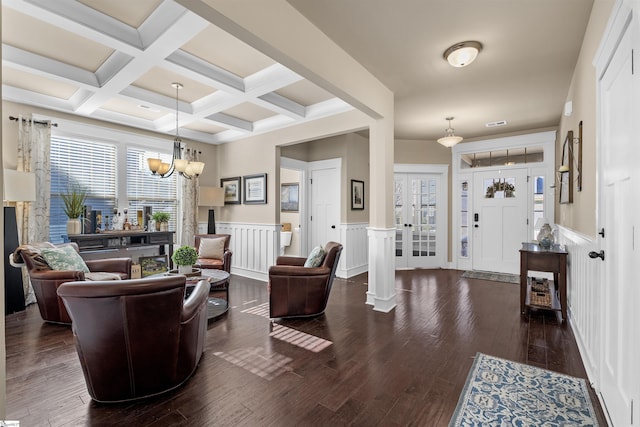 entryway with wainscoting, coffered ceiling, dark wood-type flooring, and beamed ceiling