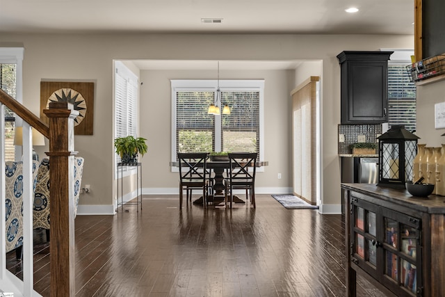 dining space with baseboards, visible vents, dark wood-style floors, stairs, and recessed lighting