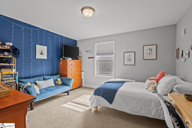 carpeted bedroom featuring visible vents and baseboards