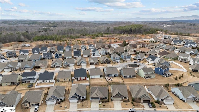 drone / aerial view featuring a mountain view and a residential view