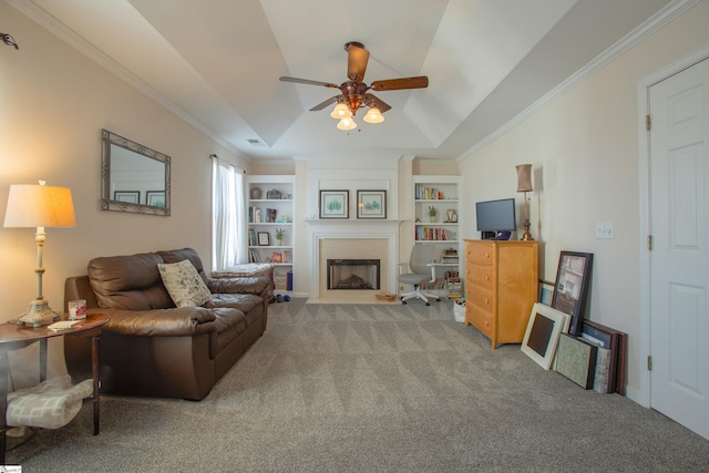 carpeted living area with a fireplace with flush hearth, built in shelves, ornamental molding, and visible vents