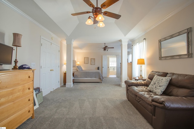 carpeted bedroom with ornamental molding, vaulted ceiling, and decorative columns