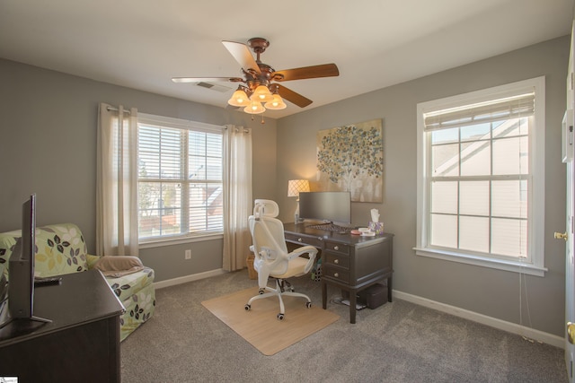 carpeted office featuring ceiling fan, visible vents, and baseboards