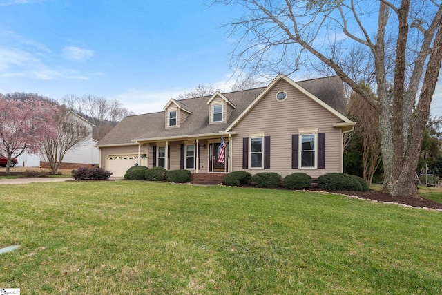 cape cod-style house featuring a shingled roof, a front yard, and an attached garage