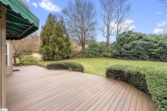 wooden deck with a lawn