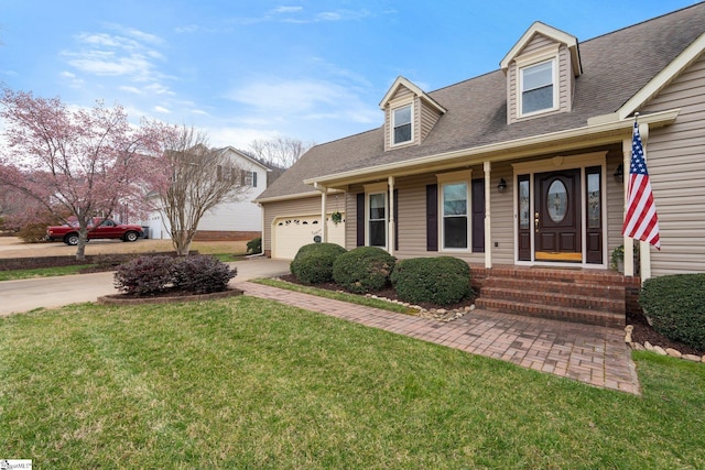 cape cod home with driveway, a shingled roof, an attached garage, and a front yard