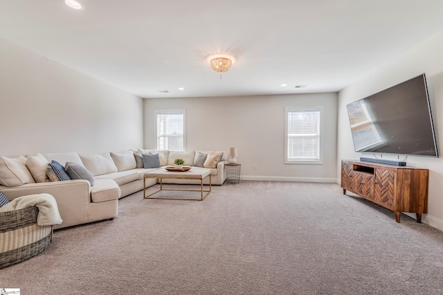 carpeted living room with baseboards and recessed lighting