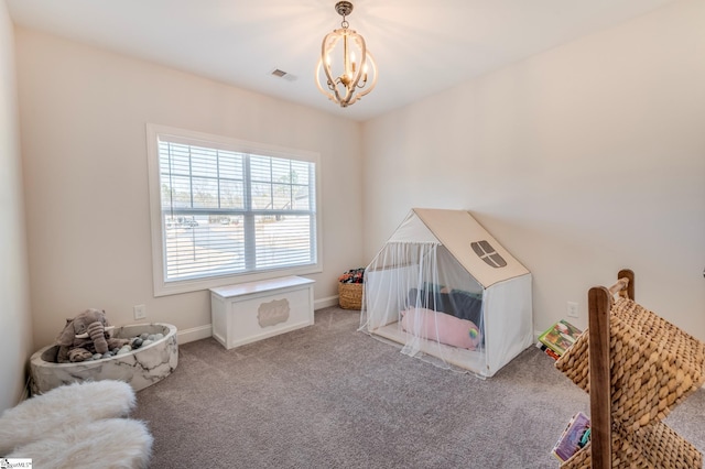 playroom with carpet floors, visible vents, a notable chandelier, and baseboards