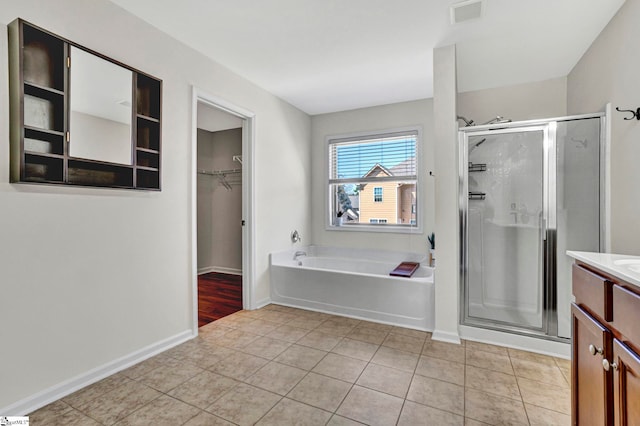 full bath with a bath, vanity, visible vents, and a shower stall