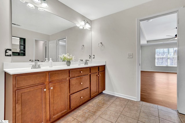 full bathroom with visible vents, a ceiling fan, a sink, baseboards, and tile patterned floors