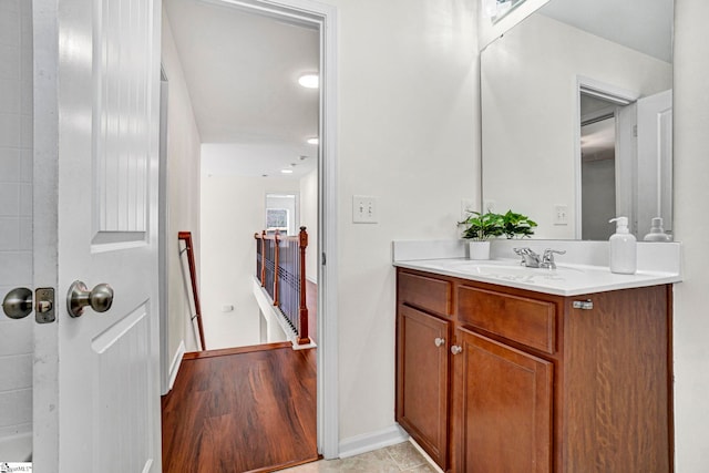 bathroom featuring vanity and baseboards