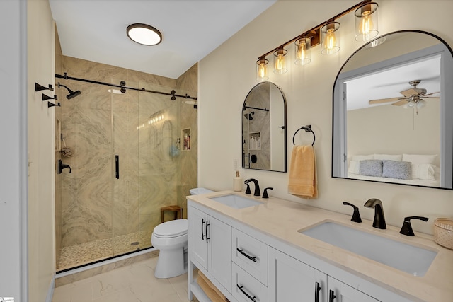 bathroom with marble finish floor, a marble finish shower, a sink, and toilet