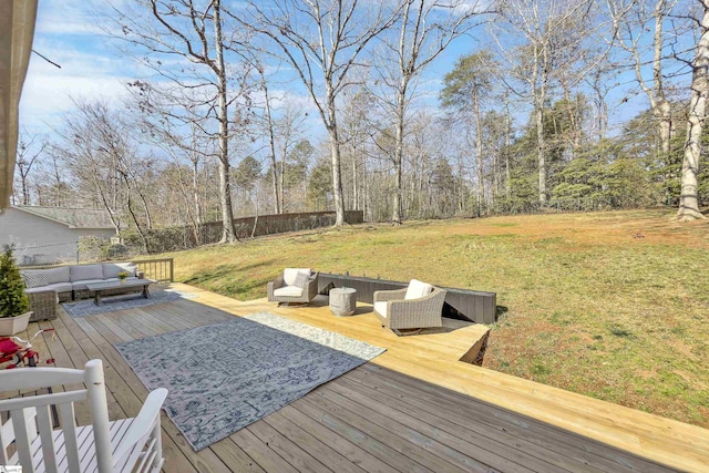 wooden deck with fence, an outdoor living space, and a lawn