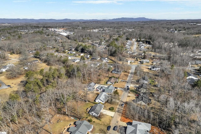 birds eye view of property featuring a mountain view