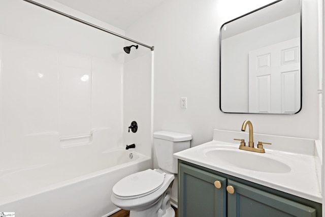 bathroom featuring toilet, bathing tub / shower combination, and vanity