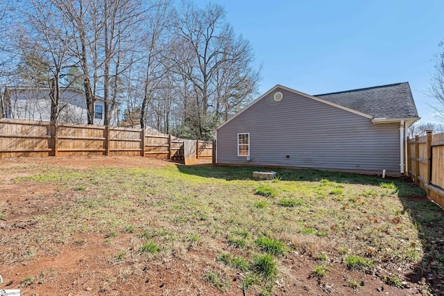 view of yard with a fenced backyard