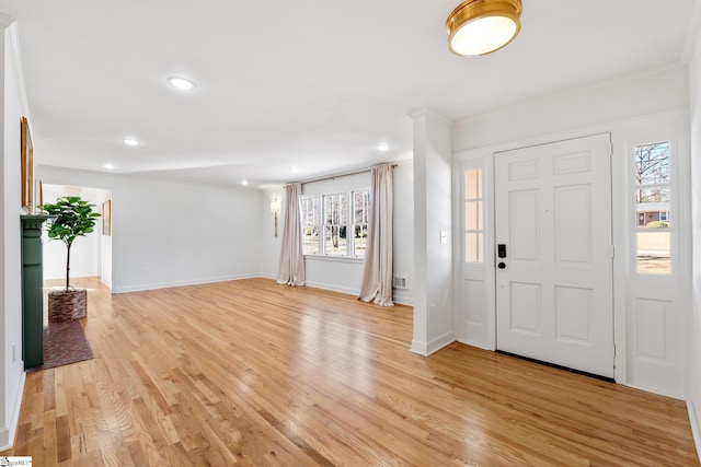 foyer featuring recessed lighting, light wood-type flooring, and baseboards