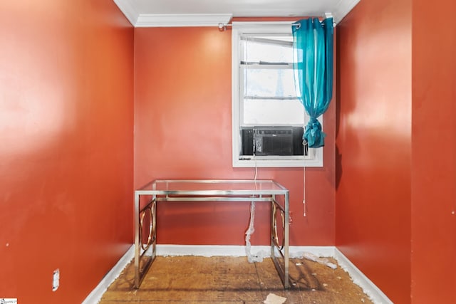 interior space with cooling unit, crown molding, and baseboards