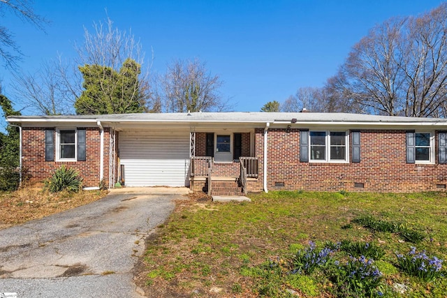 single story home featuring driveway, a front lawn, crawl space, and brick siding