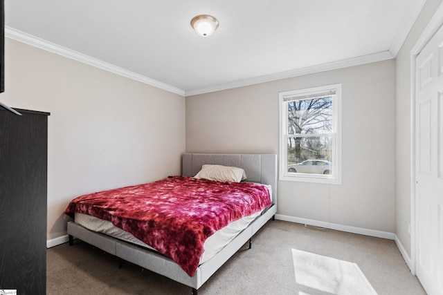 bedroom featuring ornamental molding, carpet flooring, and baseboards