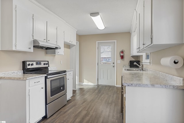 kitchen with light countertops, white cabinetry, stainless steel range with electric stovetop, and under cabinet range hood