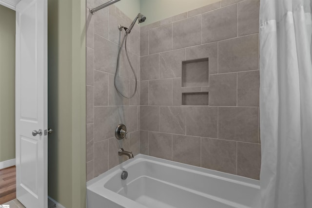 bathroom with shower / bathtub combination with curtain