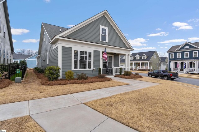 view of front of home featuring a residential view and covered porch