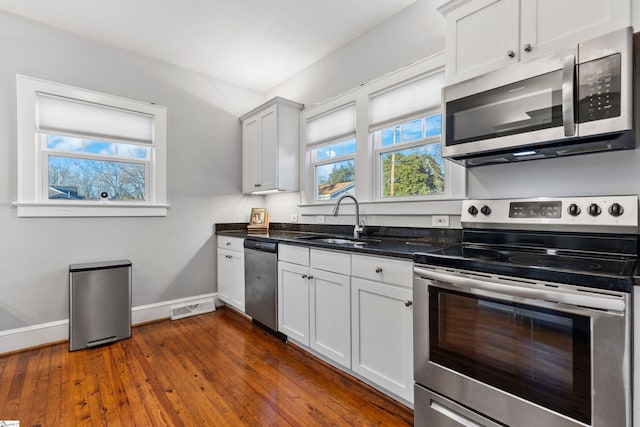 kitchen featuring a wealth of natural light, visible vents, appliances with stainless steel finishes, and a sink